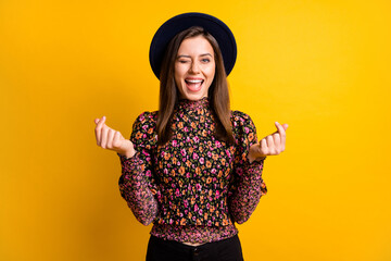 Canvas Print - Portrait of optimistic nice lady ask for money blink wear cap black shirt isolated on vibrant yellow color background