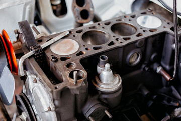 4 cylinder engine block repair close up background.