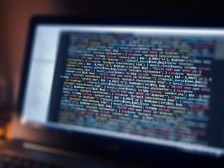 Software development monitor screen background. Developer display with source code. Programming concept