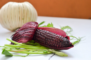 red corn on table