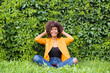 © vilma3000 - the Happy and young African American woman on the street having fun