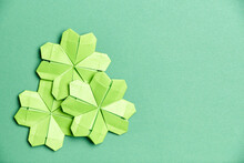 St. Patrick's Day Card: Four-leaf Paper Clovers On Green Background