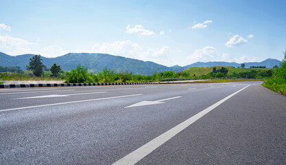 Canvas Print - Country road among the mountains