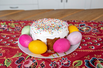 Easter cake, colorful eggs and pussy-willow on festive table