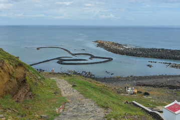 Wall Mural - Twin Hearts Stone Weir” is site linked together by two heart-shaped scenic spots, archipelago of Taiwan. 