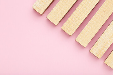 Poster - Sweet wafer sticks on pink background