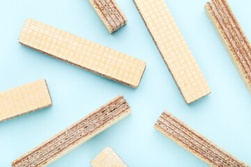 Poster - Sweet wafer sticks on blue background