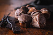 Chocolate muffins. Sweet dark cupcakes with chocolate and vanilla pods.