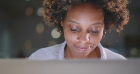concentrated young african businesswoman using laptop in office.