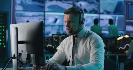 Surveillance operator browsing data on computer