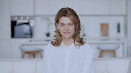Poster - portrait adult caucasian woman at home happy friendly smiling slow motion on the background white interior in flat