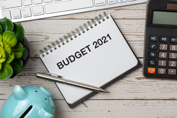 Wall Mural - Budget 2021 on notepad with calculator, computer keyboard and piggy bank- Business concept
