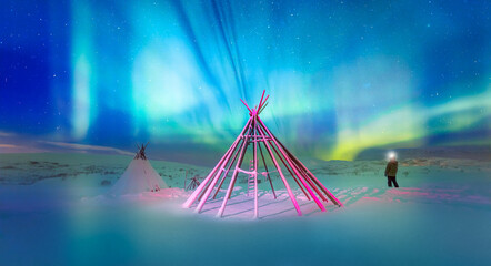 Wall Mural - a man illuminates the sky with the lantern and triangle cloth tent - tromso, norway - northern light