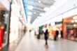 © Aleksei - Abstract blurred background of modern luxury department store hall or shopping center mall. Blurred lights background. Blurred defocused bokeh lights with modern white interior architecture