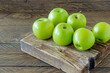© Marina - Green ripe apples on wooden desk. Rustic style. eco-friendly farming. sustainable food