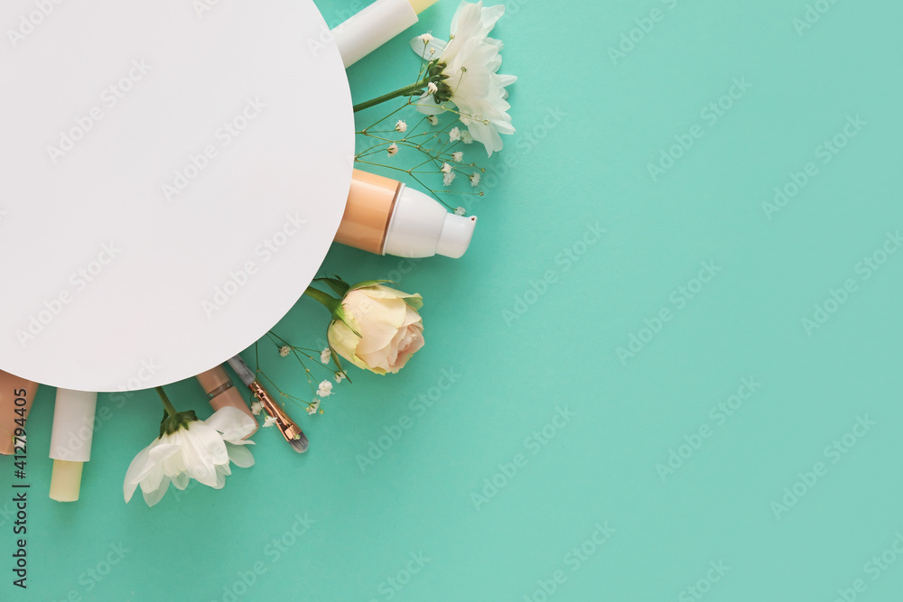 Composition with cosmetics, blank card and spring flowers on color background