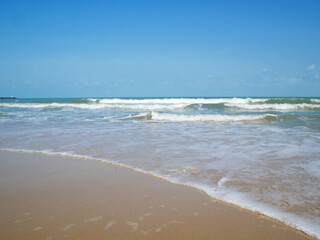 Beautiful tropical sea and sand beach with blue sky in sunny day