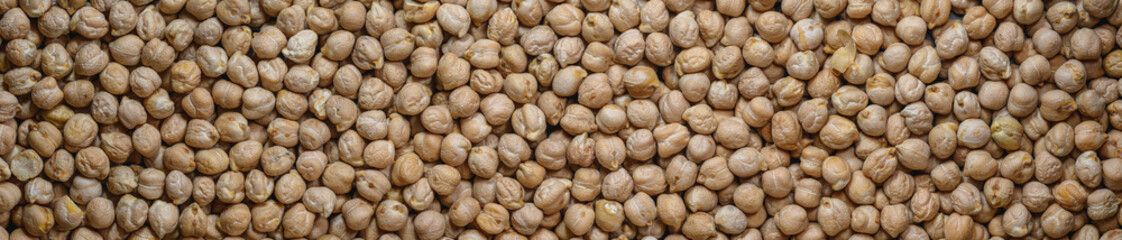 Close-up chickpeas, dry beans. chickpeas seeds abstract panoramic background. 