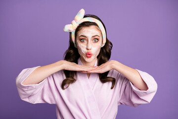 Poster - Photo portrait of girl wearing bathrobe looking in mirror on cosmetic effect sending air kiss isolated on vivid violet color background