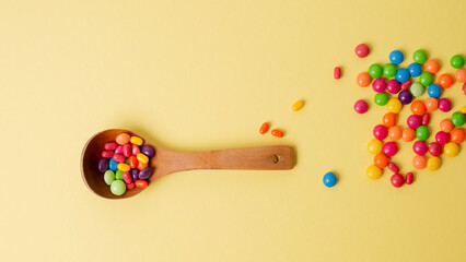 multicolored candy set with a wooden spoon