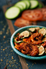 Poster - sliced dried tomato and zucchini, served as snack