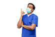 © Syda Productions - healthcare, profession and medicine concept - indian doctor or male nurse in blue uniform and face protective medical mask for protection from virus disease pointing finger up over white background
