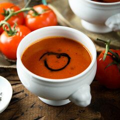 Canvas Print - Homemade spicy tomato soup in a white bowl