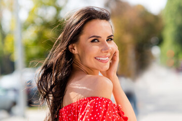 Poster - Profile side photo of sweet cute pretty young woman dressed red off-shoulders dress arm cheek outdoors street city urban