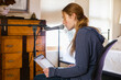 © Mint Images - Teenage girl singing into a microphone in her bedroom