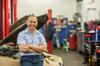 © Mint Images - Portrait of Pacific Islander car mechanic in auto repair shop