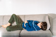 © Anna - sick child, stomach pain, unhappy, quarantine, ill, after day, alone, boy, casual, caucasian, cheerful, child, childhood, children, couch, covid, emotion, expression, expressions, face, family, guy, h
