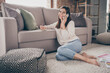 © deagreez - Full length photo of positive charming girl speak phone write note good mood sit home floor inside house indoors