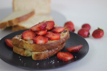 Wall Mural - French toast with fresh cut strawberries for breakfast