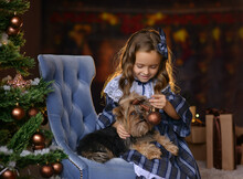 Girl In Retro Dress Plays With Dog