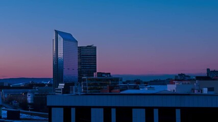 Sticker - Oslo, Norway. A night view of the Sentrum area of Oslo, Norway, with modern and historical buildings and car traffic. Sunset colorful sky in summer with car traffic, time-lapse, panning video