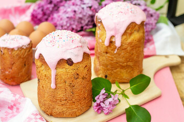 Wall Mural - Slavic Orthodox Easter bread Kulich with raisins, nuts and pink icing