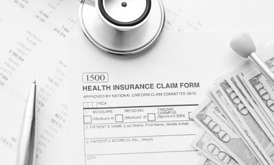 Health Insurance Claim Form. Individual medical health insurance policy with stethoscope and dollar banknotes.