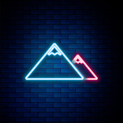 Wall Mural - Glowing neon line Mountains icon isolated on brick wall background. Symbol of victory or success concept. Colorful outline concept. Vector.