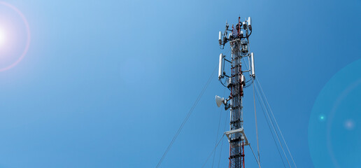 workers are working at 5g antenna tower for maintaining.serves cellular antenna, technician worker repair telecommunication tower on sunlight at background.	
