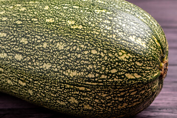 Wall Mural - green zucchini close up on a dark wooden background