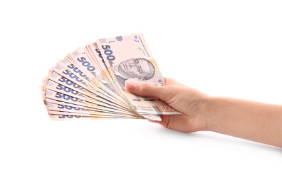 Woman holding Ukrainian money on white background, closeup