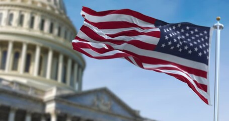 Wall Mural - American flag waving with the US Capitol Hill blurred in the background