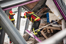 The Working Moments Of The Search And Rescue Teams Who Were Under The Rubble In The Roof Collapse Under The Weight Of Snow. Firefighters Inside A Collapsed House Are Looking For Survivors.