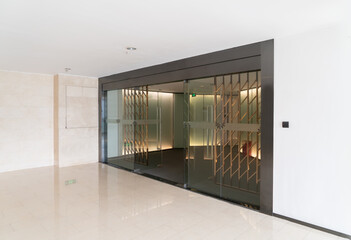 Wall Mural - A modern office building with glass doors and windows