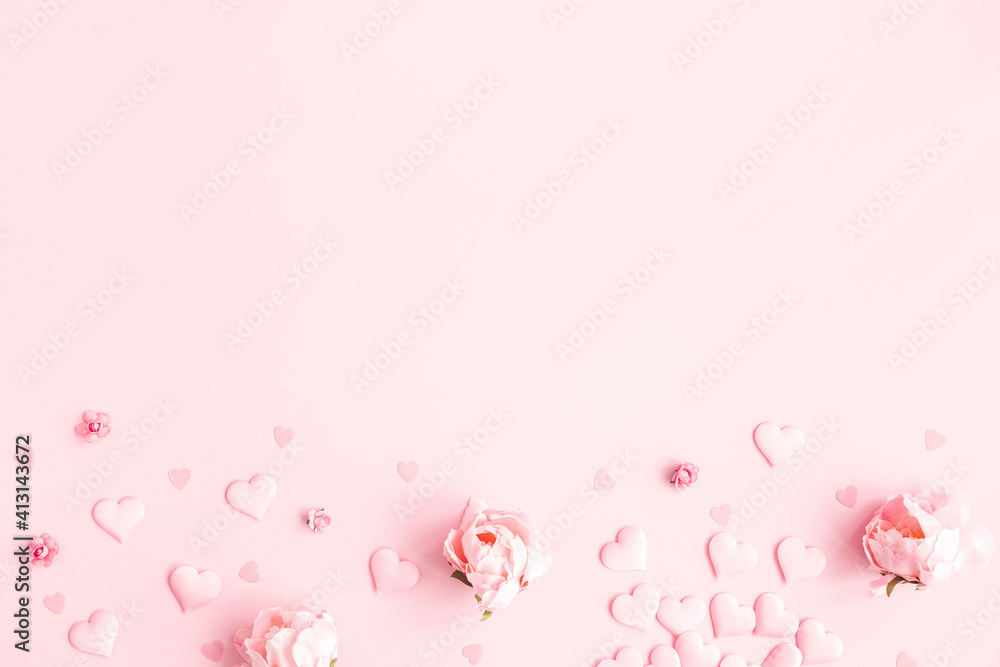 Valentine's Day background. Frame made of pink flowers, hearts on pastel pink background. Valentines day concept. Flat lay, top view, copy space - obrazy, fototapety, plakaty 
