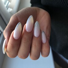 Stylish trendy female pink manicure.Hands of a woman with pink manicure on nails