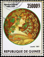 Illustration Of Woman By Alfonse Mucha On Postage Stamp Of Guinea