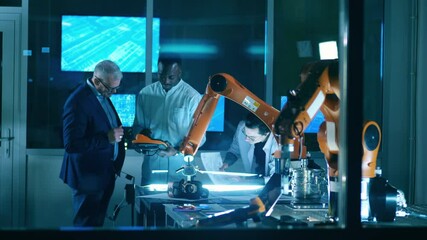 Wall Mural - male scientists are talking while experimenting with robots