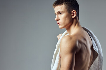 handsome guy inflated torso towel close-up look to the side