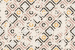 © psk55 - Seamless geometric pattern with an effect of attrition. Abstract retro vector texture. Vintage shabby carpet. Lattice graphic design. Vector tiles pattern in brown and beige.